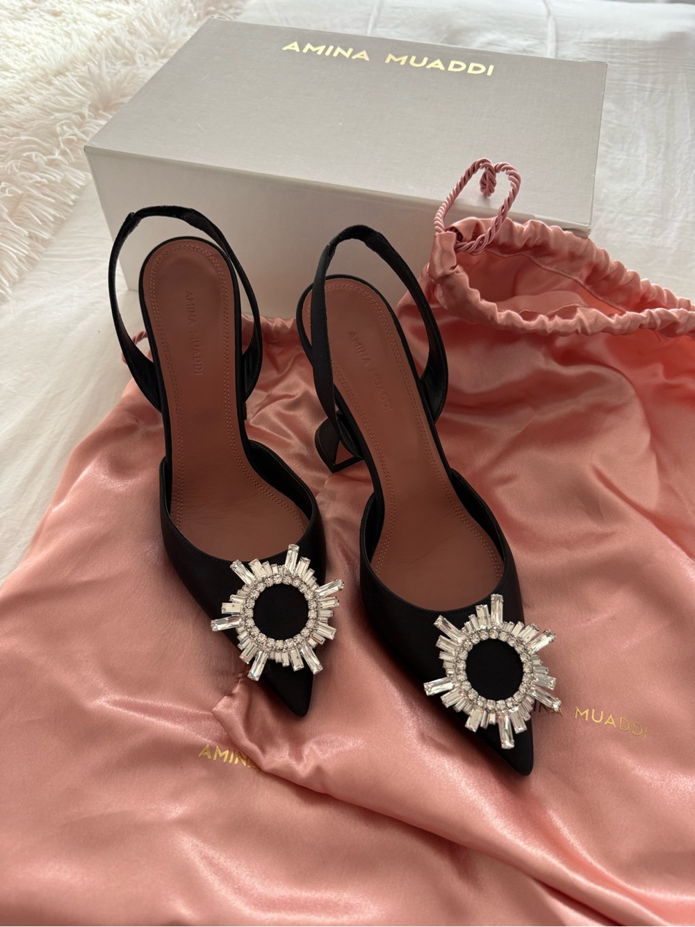 Amina Muaddi Black Slingback Pumps with Crystal Sunburst